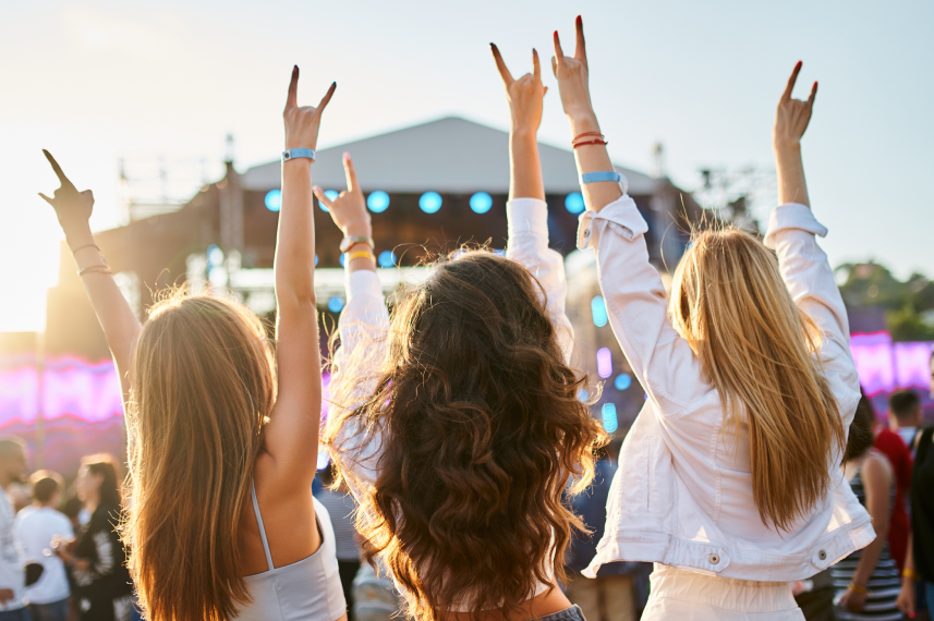 Three women enjoying a concert