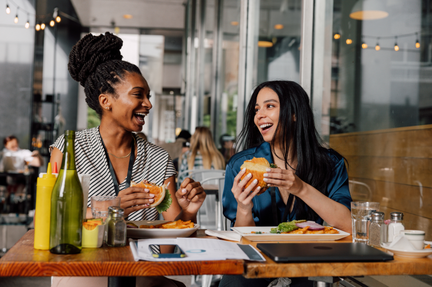 Two women sitting and eating